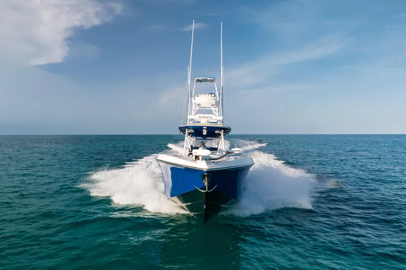 Slide: The Image of 2022 Nor-Tech 392 Super Fish boat cruising on open ocean waters. - 1
