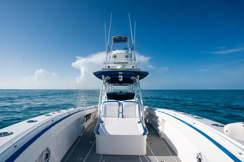 Slide: The Image of 2022 Nor-Tech 392 Super Fish boat on open ocean under clear blue sky. - 12
