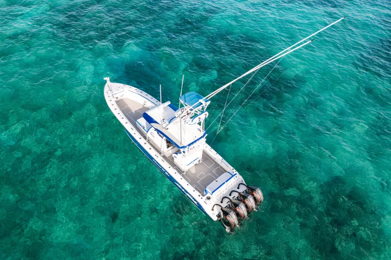 Slide: The Image of Aerial view of 2022 Nor-Tech 392 Super Fish boat on clear turquoise water. - 3