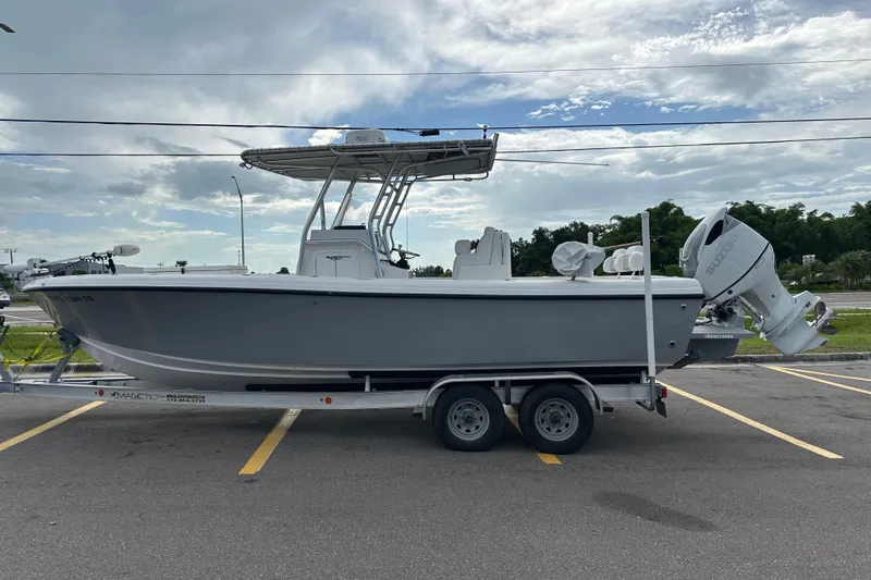 The Image of 2022 Bluewater 2550 CC boat on trailer under cloudy sky. - 0