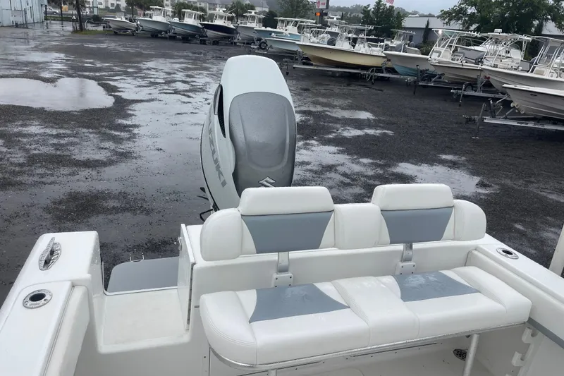 Slide: The Image of 2022 Bluewater 2550 CC boat with Suzuki outboard engine in a wet boatyard. - 10
