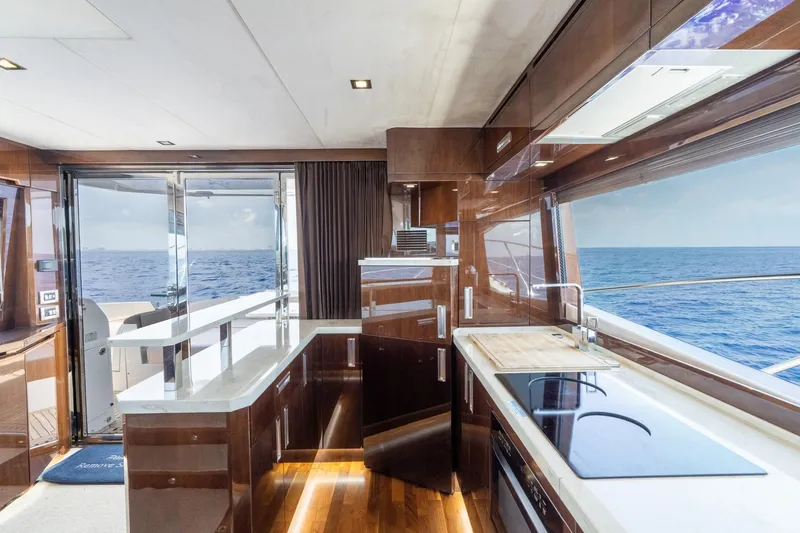Slide: The Image of Luxurious interior of 2017 Galeon 550 Fly yacht with ocean view through large windows. - 38