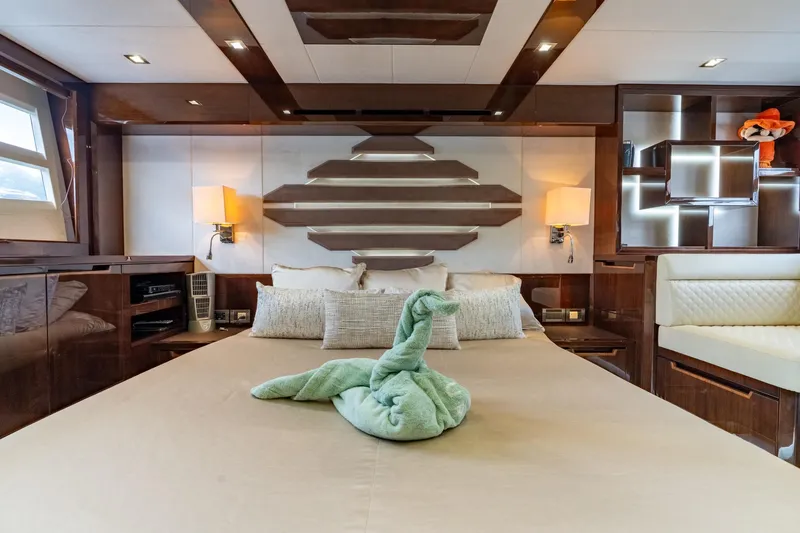 Slide: The Image of Luxurious bedroom interior of 2017 Galeon 550 Fly yacht with elegant decor and plush bedding. - 42