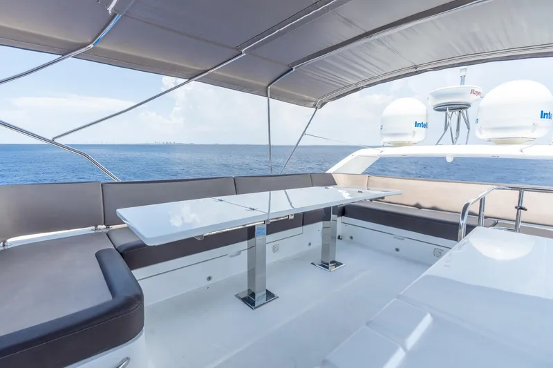 Slide: The Image of Flybridge seating area on 2017 Galeon 550 Fly yacht with ocean view. - 18