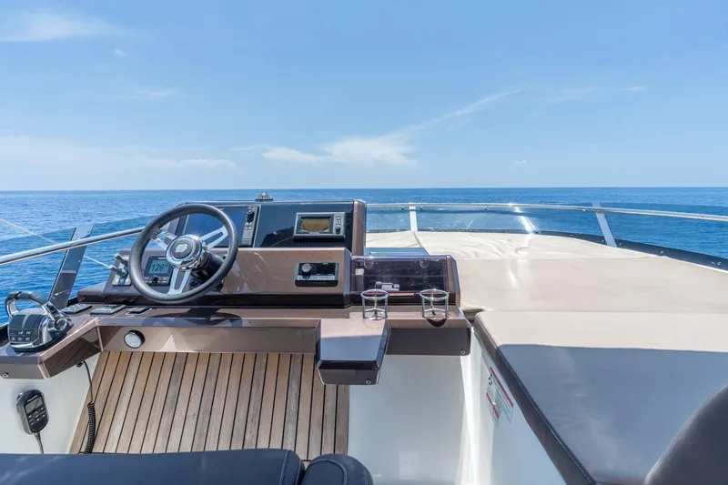 Slide: The Image of Flybridge helm of 2017 Galeon 550 Fly yacht with ocean view. - 22