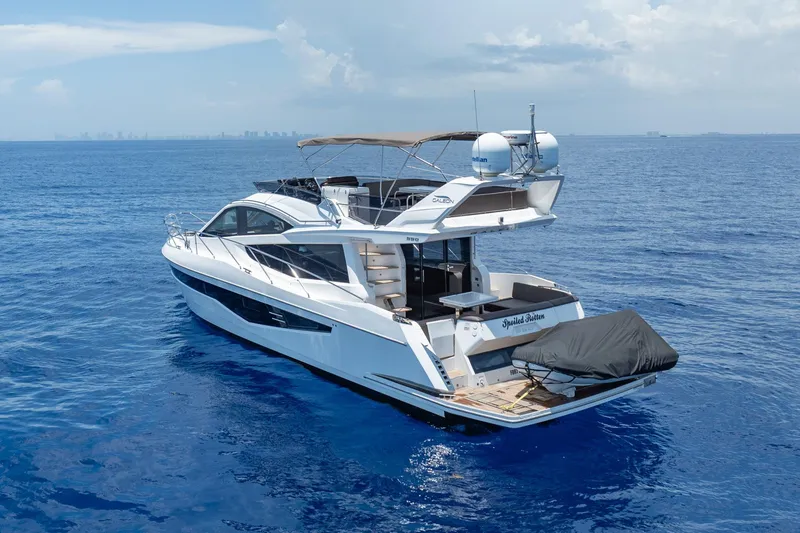 Slide: The Image of 2017 Galeon 550 Fly yacht cruising on open blue sea under clear skies. - 7