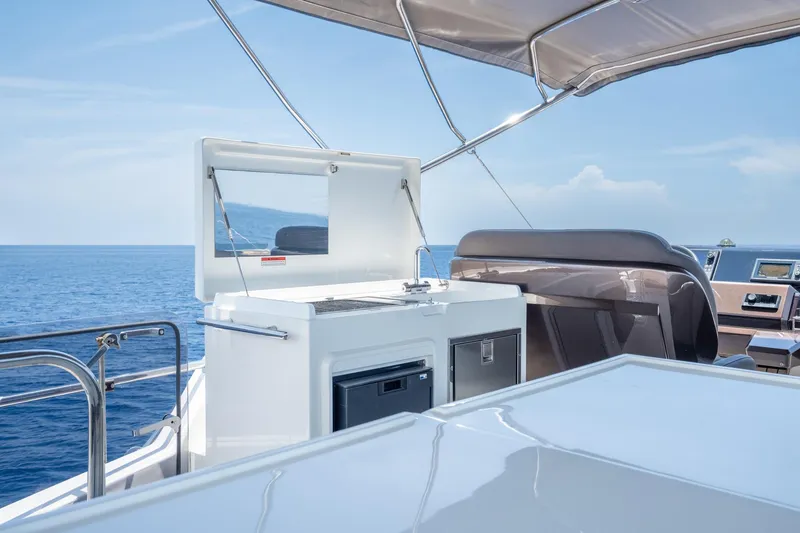 Slide: The Image of Flybridge of 2017 Galeon 550 Fly yacht with ocean view and seating area. - 21