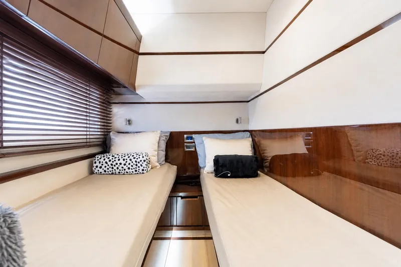 Slide: The Image of Luxurious cabin interior of 2017 Galeon 550 Fly yacht with twin beds and elegant decor. - 45