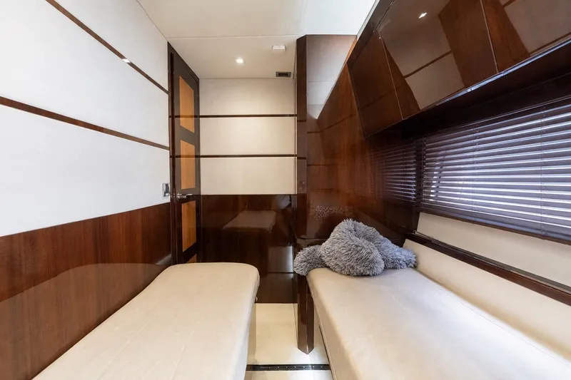Slide: The Image of Luxurious cabin interior of 2017 Galeon 550 Fly yacht with twin beds and plush decor. - 46