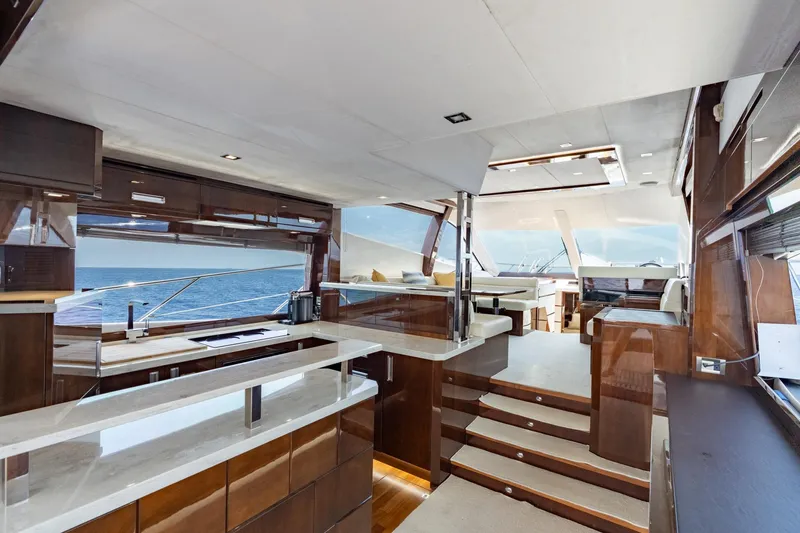 Slide: The Image of Luxurious interior of 2017 Galeon 550 Fly yacht with elegant wood finishes and ocean view. - 30