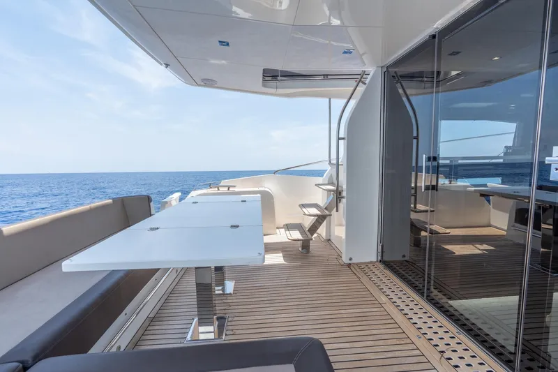 Slide: The Image of Luxurious 2017 Galeon 550 Fly yacht deck with ocean view and modern seating area. - 16