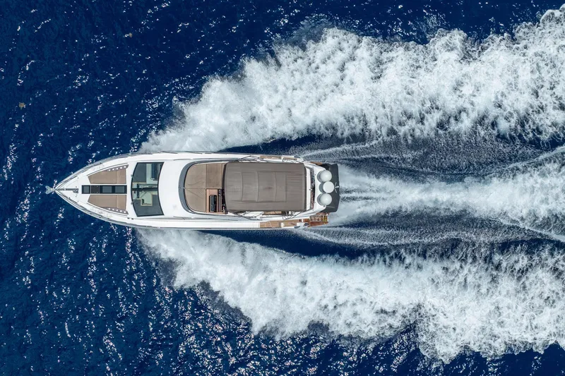 The Image of Aerial view of 2017 Galeon 550 Fly yacht cruising on deep blue ocean waters. - 1