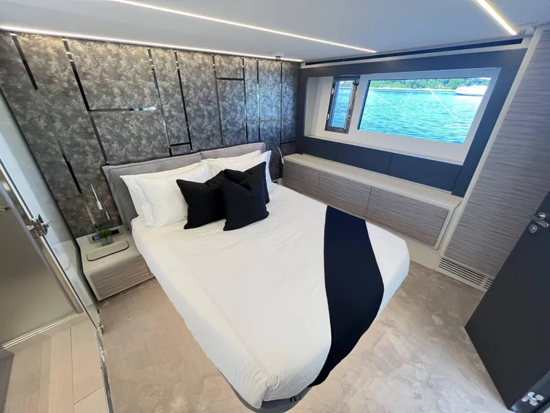 Slide: The Image of Elegant bedroom on a Pershing 6X yacht with modern design and water view. - 11