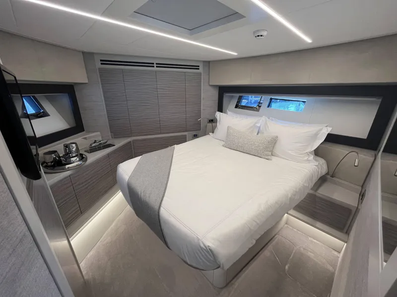 Slide: The Image of Luxurious bedroom on a modern yacht with a large bed and stylish design. - 13
