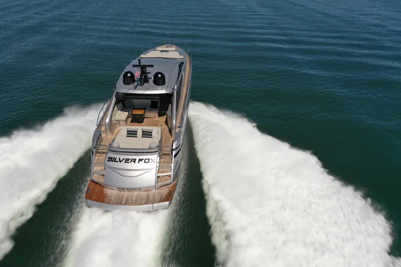 Slide: The Image of A luxury motorboat speeds across the water, leaving a white wake behind. - 2
