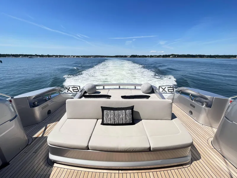 Slide: The Image of Luxurious boat with beige sofa, cruising on calm water under a blue sky. - 20
