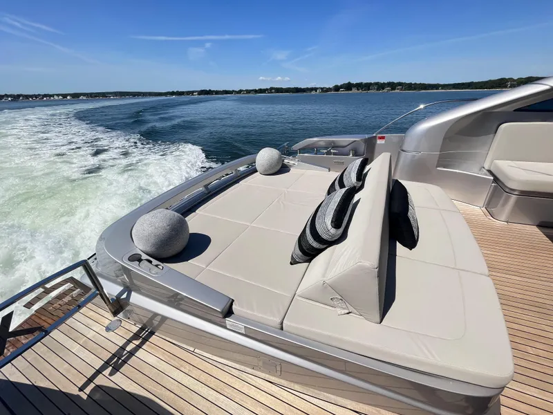 Slide: The Image of Luxurious sun deck of a Pershing 6X yacht on the water, featuring cushions and stylish design. - 21
