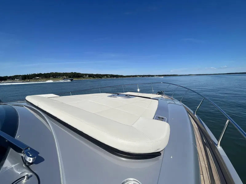 Slide: The Image of Luxury yacht with sunbed on calm water under clear sky. - 25