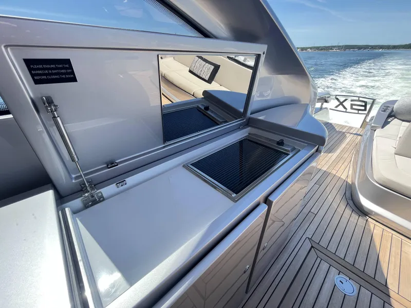 Slide: The Image of A modern yacht with sleek features and wooden deck on the water. - 29