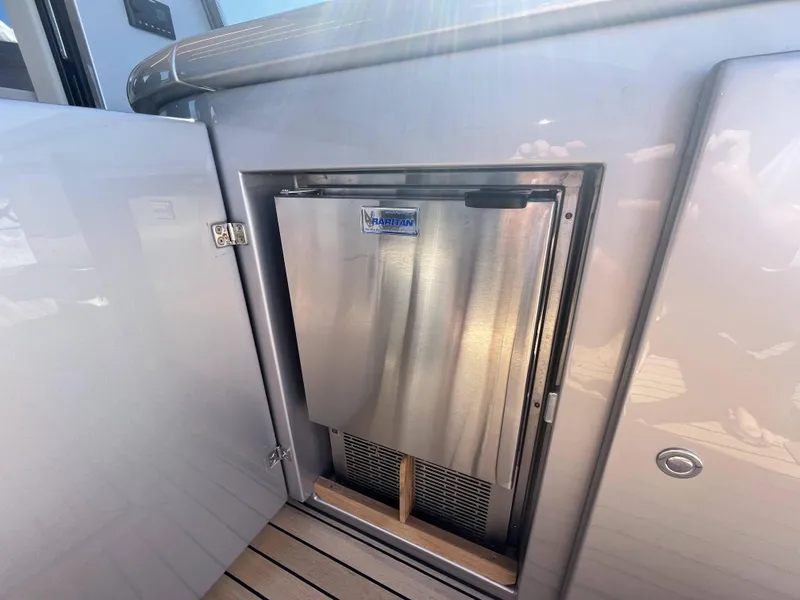 Slide: The Image of A refrigerator is installed in a cabinet on a boat. - 31