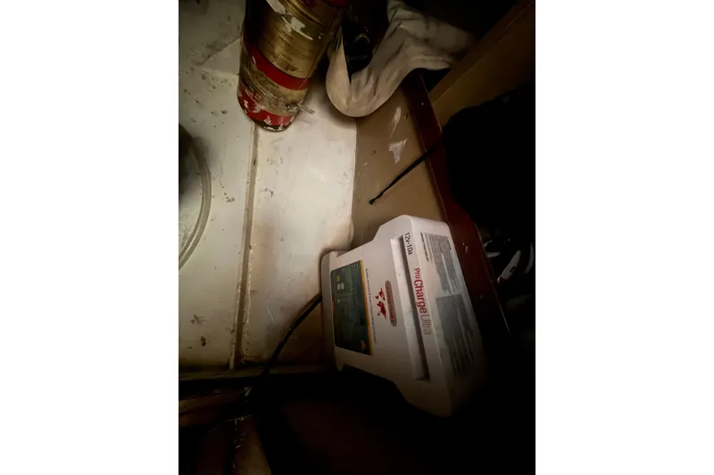 Slide: The Image of Battery charger in a 1991 Hylan Offshore Steel Cutter boat interior. - 12