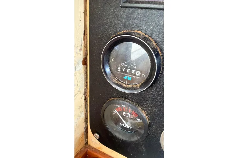 Slide: The Image of Close-up of gauges on a 1991 Hylan Offshore Steel Cutter boat. - 19