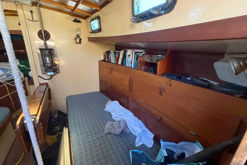 Slide: The Image of Interior of 1991 Hylan Offshore Steel Cutter with wooden cabinetry and cozy seating area. - 2