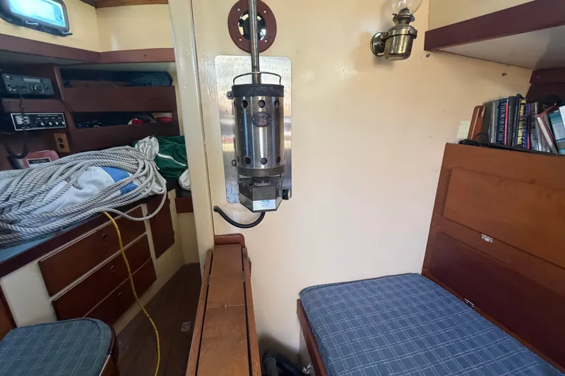 Slide: The Image of Interior of a 1991 Hylan Offshore Steel Cutter with nautical equipment and cozy seating. - 3