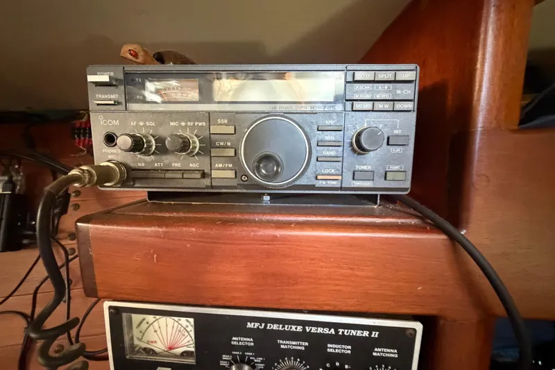 Slide: The Image of Radio equipment on a 1991 Hylan Offshore Steel Cutter boat, featuring Icom transceiver and MFJ tuner. - 6