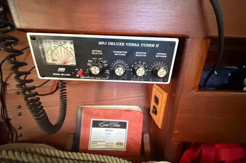 Slide: The Image of MFJ Deluxe Versa Tuner II on 1991 Hylan Offshore Steel Cutter, wooden interior detail. - 7
