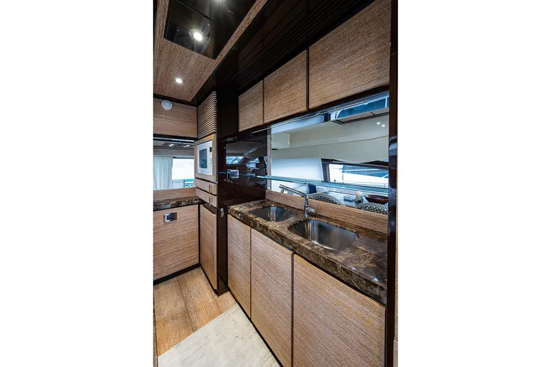 Slide: The Image of Luxurious kitchen interior of 2011 Azimut 70 yacht with modern amenities and sleek design. - 31