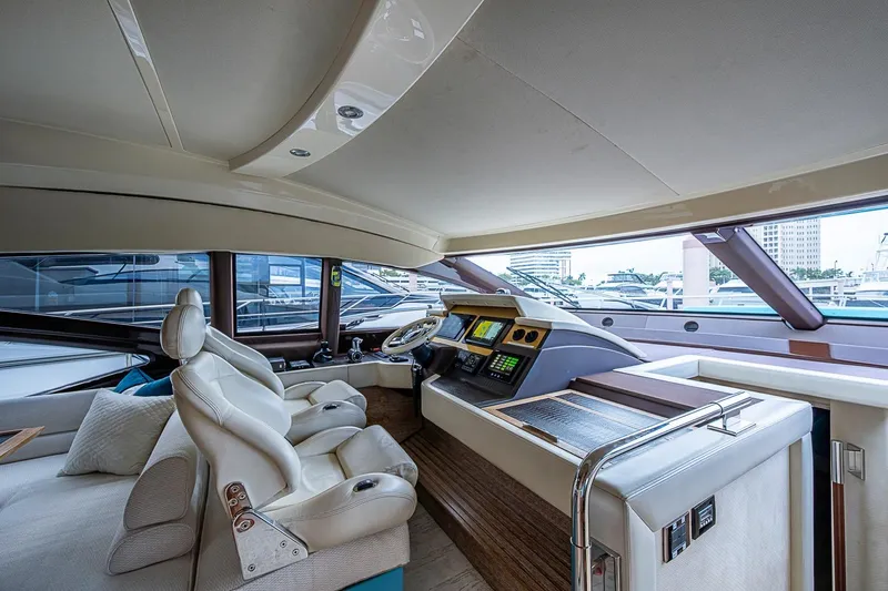 Slide: The Image of Luxurious interior of a 2011 Azimut 70 yacht with modern helm and plush seating. - 34