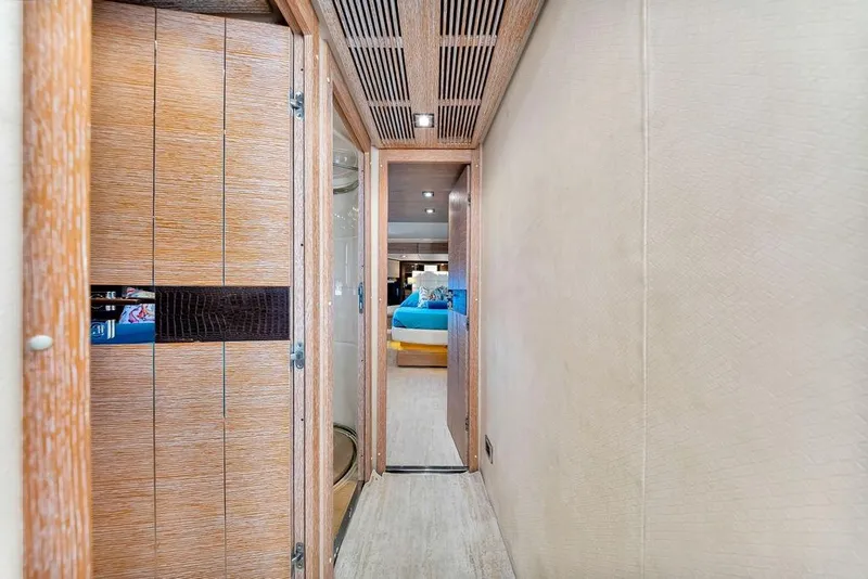 Slide: The Image of Hallway inside 2011 Azimut 70 yacht, featuring wooden doors and modern interior design. - 52