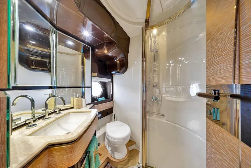 Slide: The Image of Luxurious bathroom in a 2011 Azimut 70 yacht, featuring modern fixtures and elegant design. - 58
