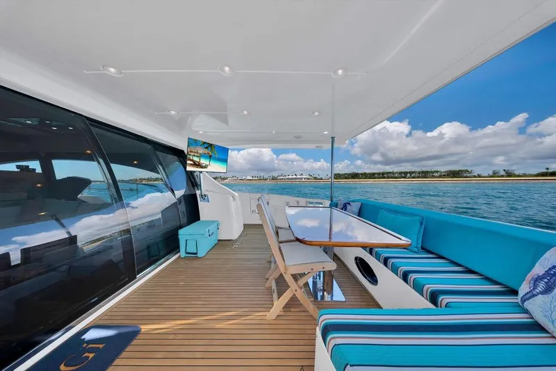 Slide: The Image of Luxurious 2011 Azimut 70 yacht deck with elegant seating, ocean view, and modern amenities. - 61