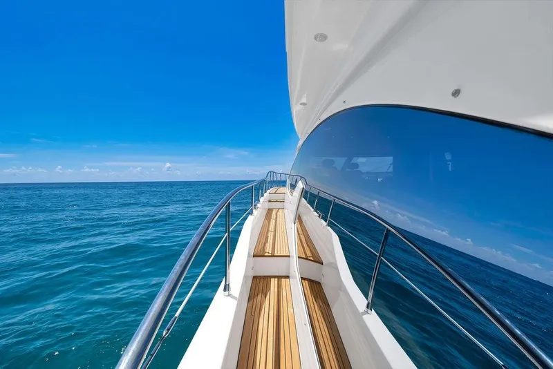 Slide: The Image of Luxurious 2011 Azimut 70 yacht cruising on clear blue ocean waters. - 67