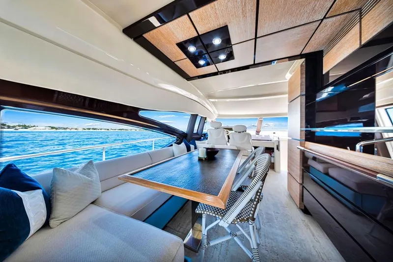 Slide: The Image of Luxurious interior of a 2011 Azimut 70 yacht with ocean view and elegant seating. - 84