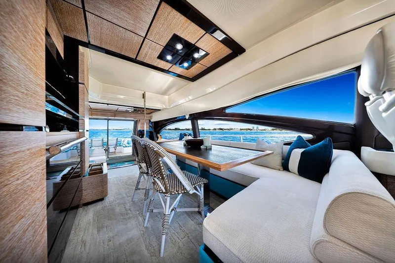 Slide: The Image of Luxurious interior of a 2011 Azimut 70 yacht with elegant seating and ocean views. - 89