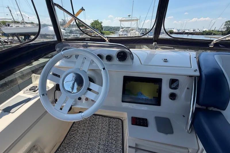 Slide: The Image of Cockpit of 2007 Azimut 43 yacht with steering wheel and navigation display. - 17