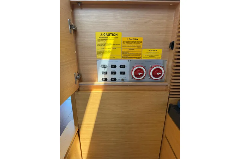 Slide: The Image of Electrical panel with caution labels on a 2007 Azimut 43 yacht. - 26