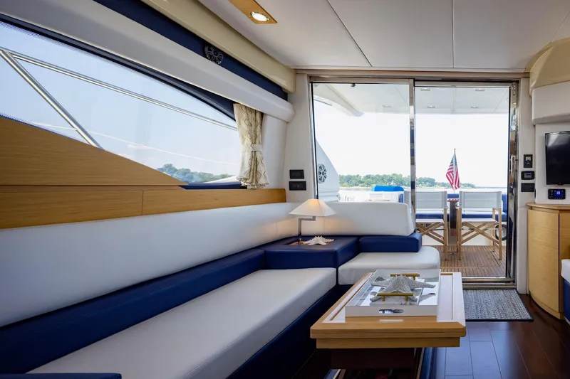 Slide: The Image of Luxurious interior of 2007 Azimut 43 yacht with elegant seating and outdoor view. - 10