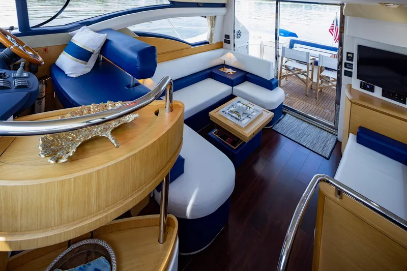 Slide: The Image of Luxurious interior of a 2007 Azimut 43 yacht with elegant seating and modern amenities. - 11