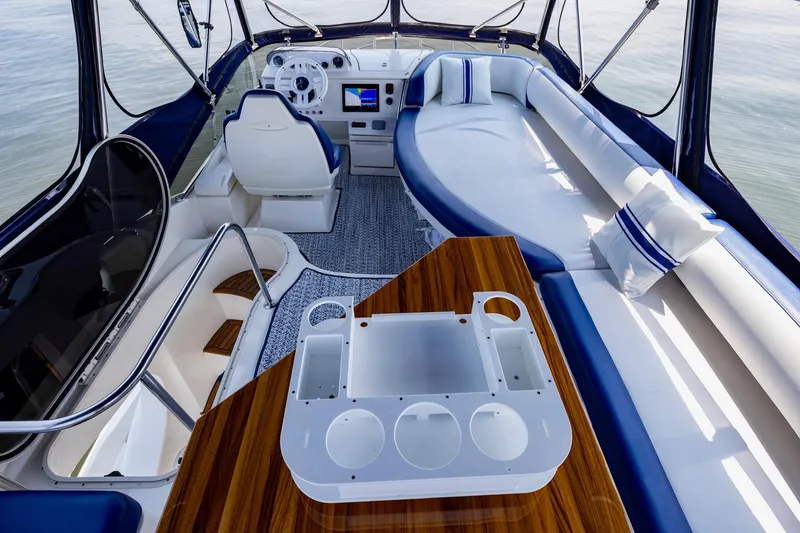 Slide: The Image of Luxurious interior of a 2007 Azimut 43 yacht with elegant seating and helm. - 13