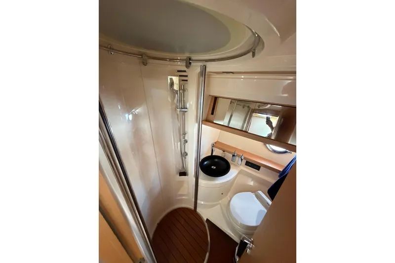Slide: The Image of Bathroom interior of 2007 Azimut 43 yacht, featuring shower, sink, and toilet. - 24