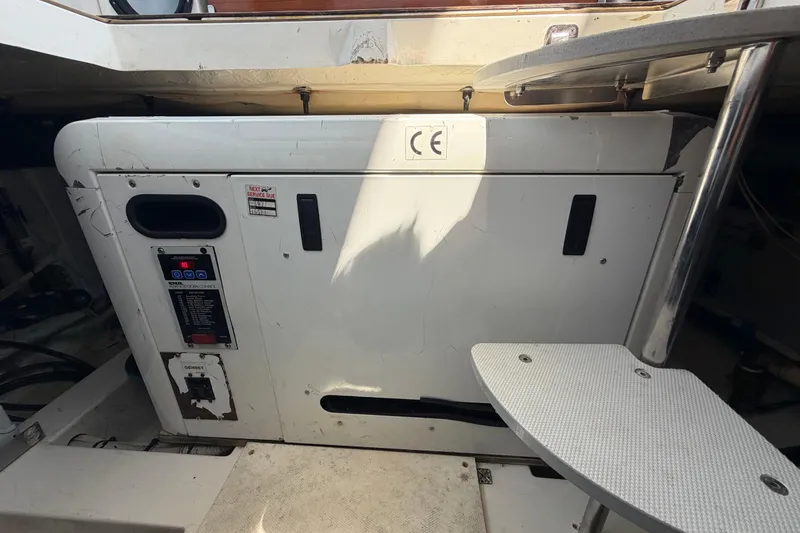 Slide: The Image of Engine compartment of a 2007 Azimut 43 yacht, featuring control panel and equipment. - 25