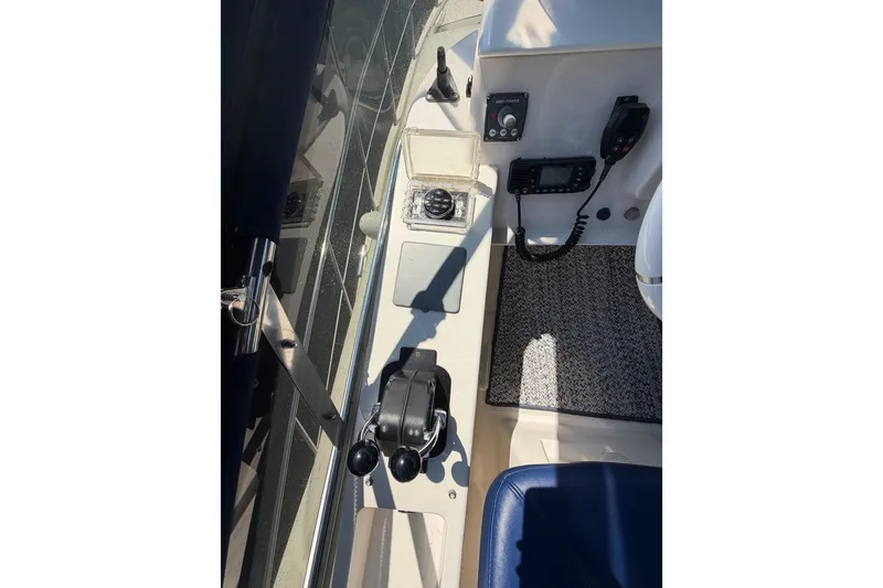 Slide: The Image of Control panel of a 2007 Azimut 43 yacht, featuring navigation and communication equipment. - 18