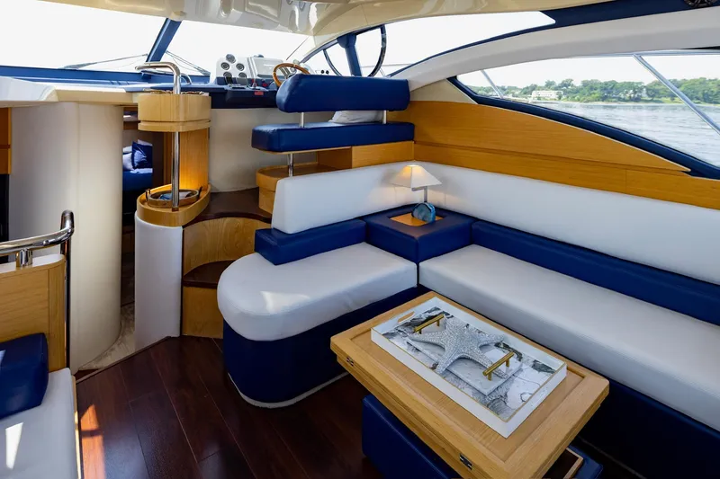 Slide: The Image of Luxurious interior of a 2007 Azimut 43 yacht with elegant seating and modern design. - 9