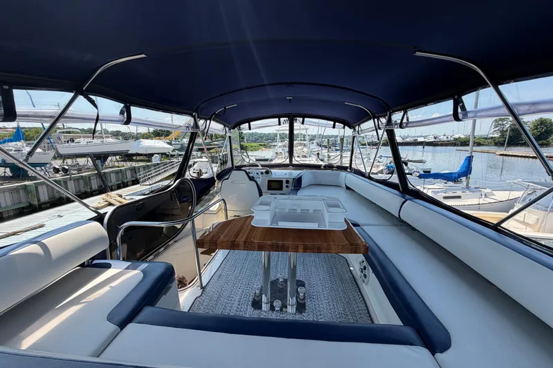 Slide: The Image of Luxurious 2007 Azimut 43 yacht interior with elegant seating and wooden table. - 20