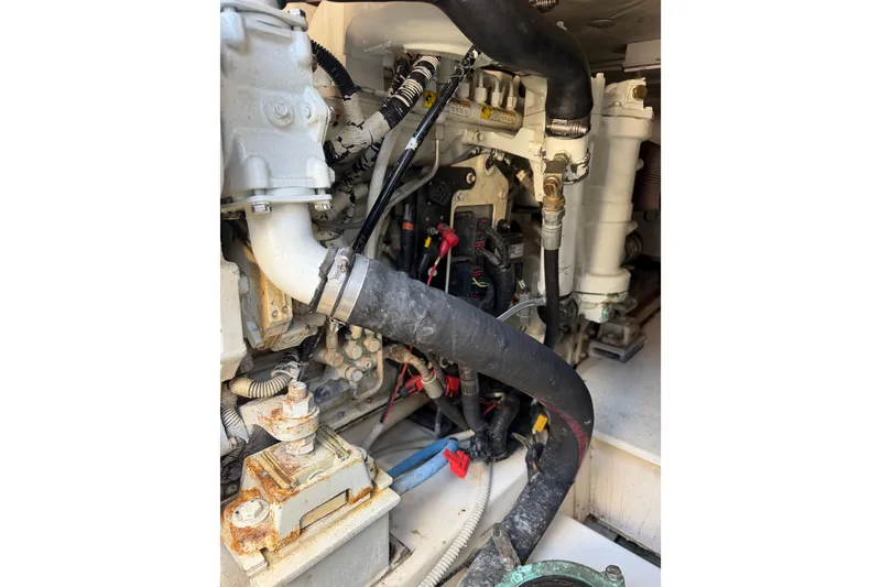 Slide: The Image of Engine compartment of a 2007 Azimut 43 yacht, showing hoses and mechanical components. - 29