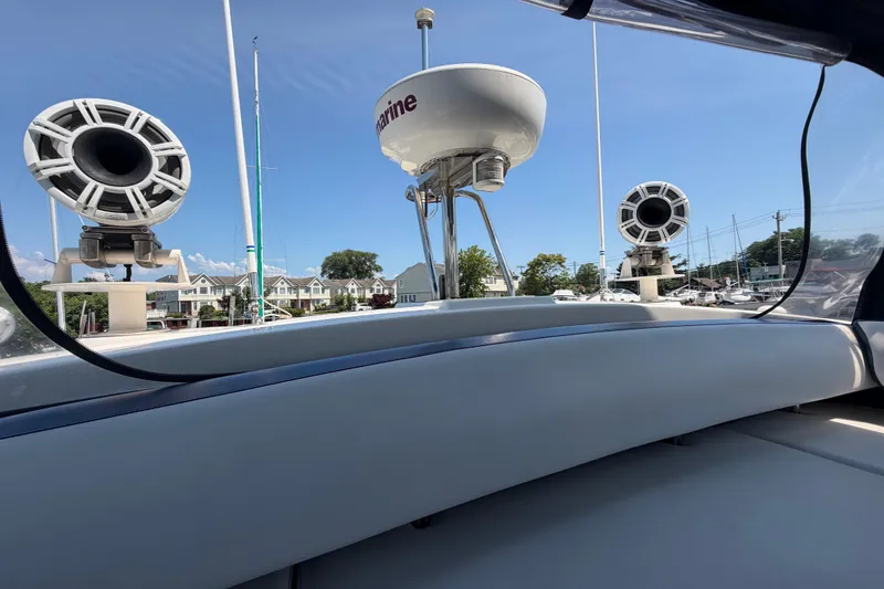 Slide: The Image of 2007 Azimut 43 yacht with speakers and radar, docked under clear blue sky. - 19